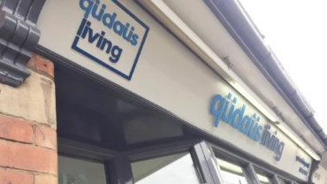 qudaus living signage Mere Green
