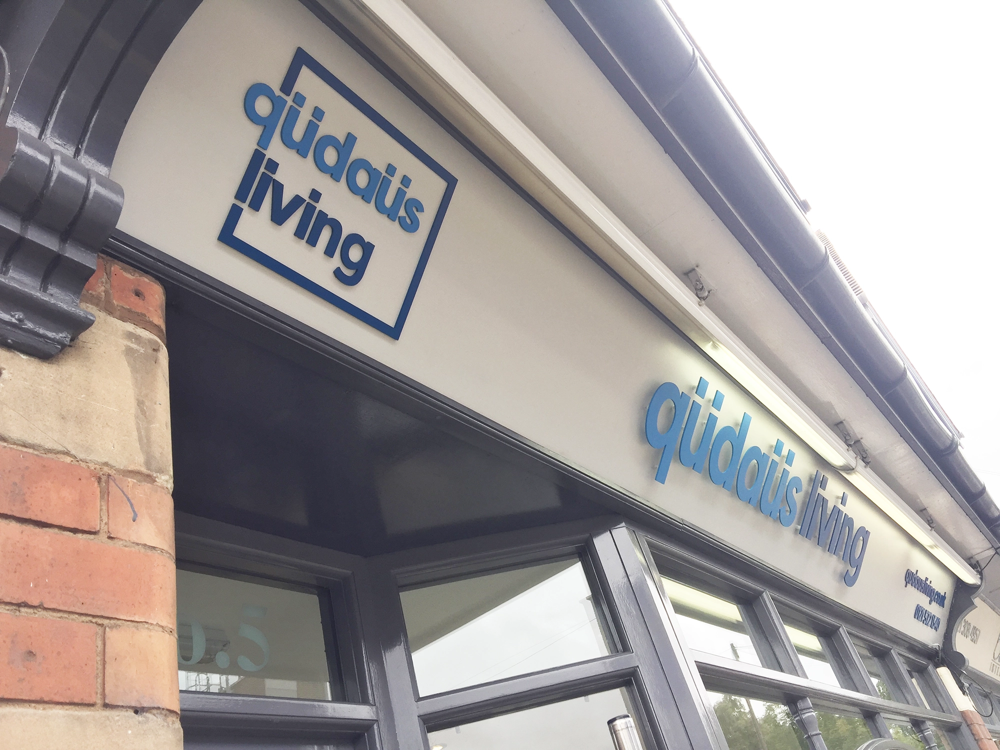 qudaus living signage Mere Green